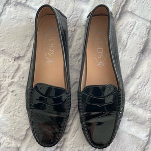 Tod’s women’s Gommino black patent leather loafer.